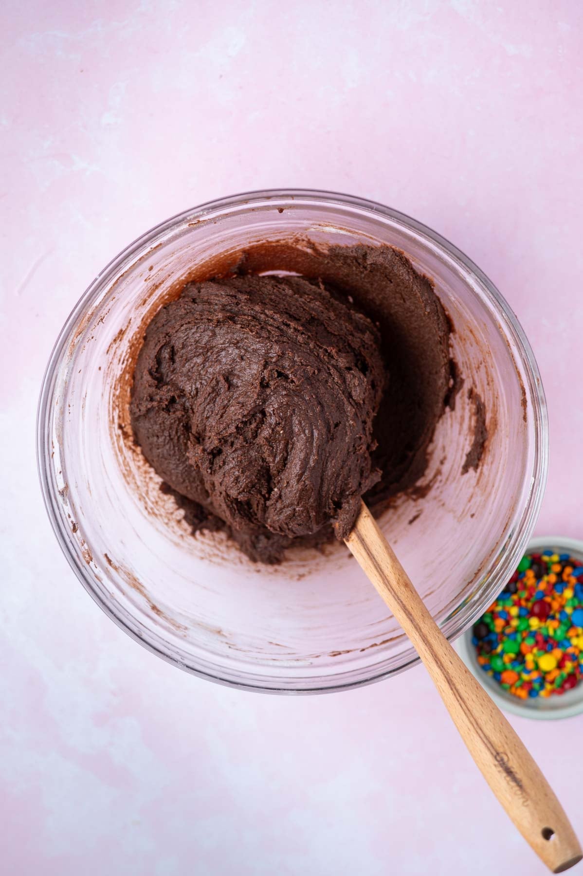 brownie cookie dough in a bowl with a spatula