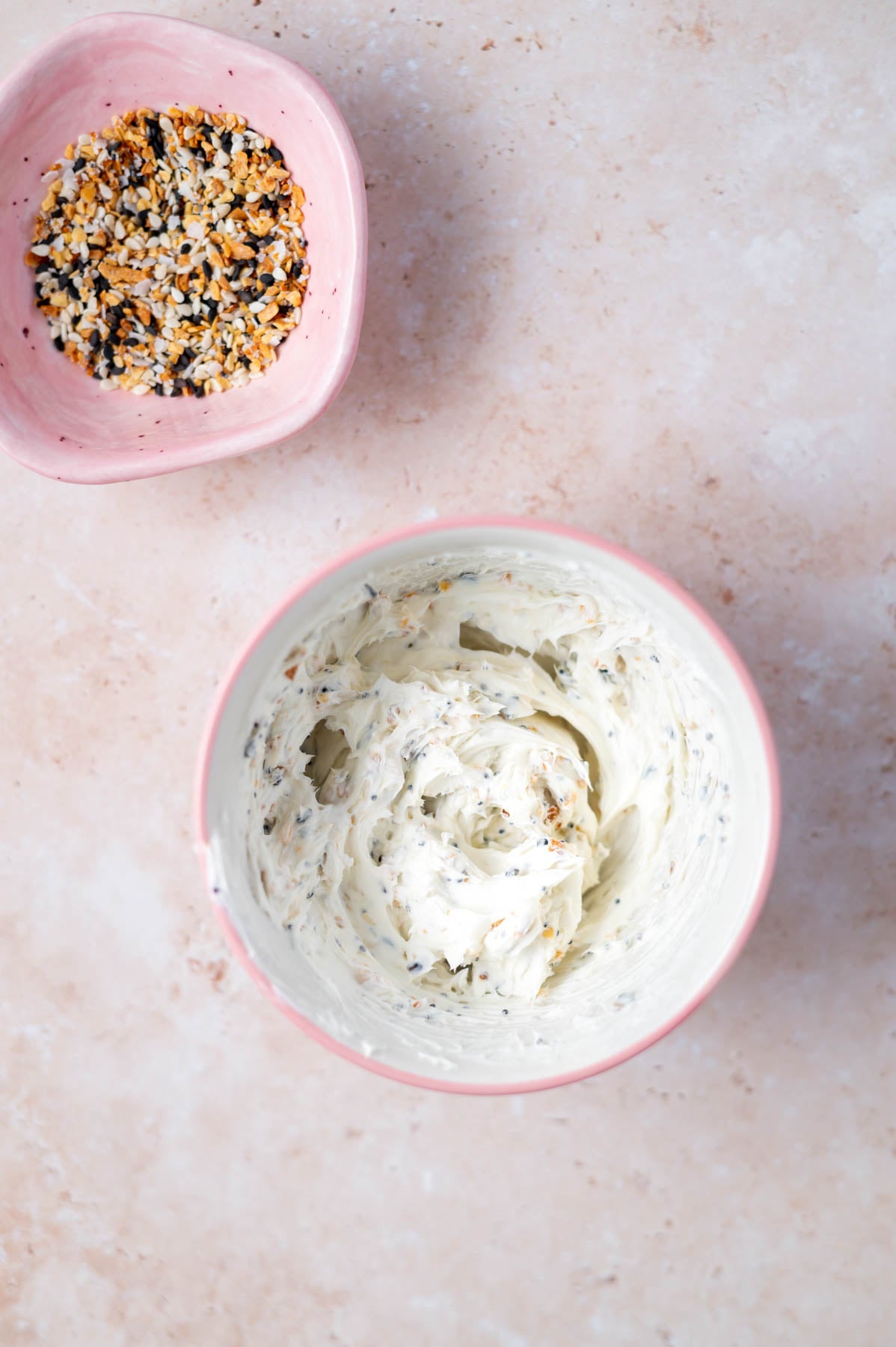 cream cheese with everything bagel seasoning mixed in in a bowl