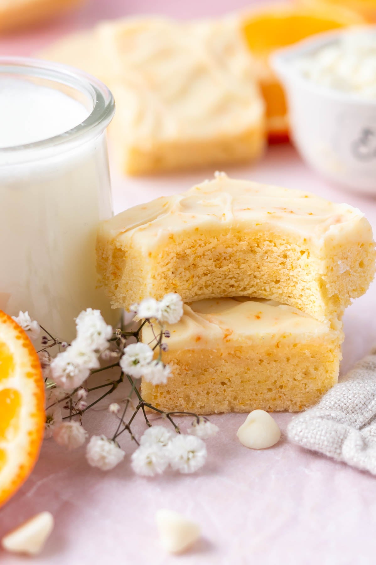 stack of two orange dream bars with the top one missing a bite