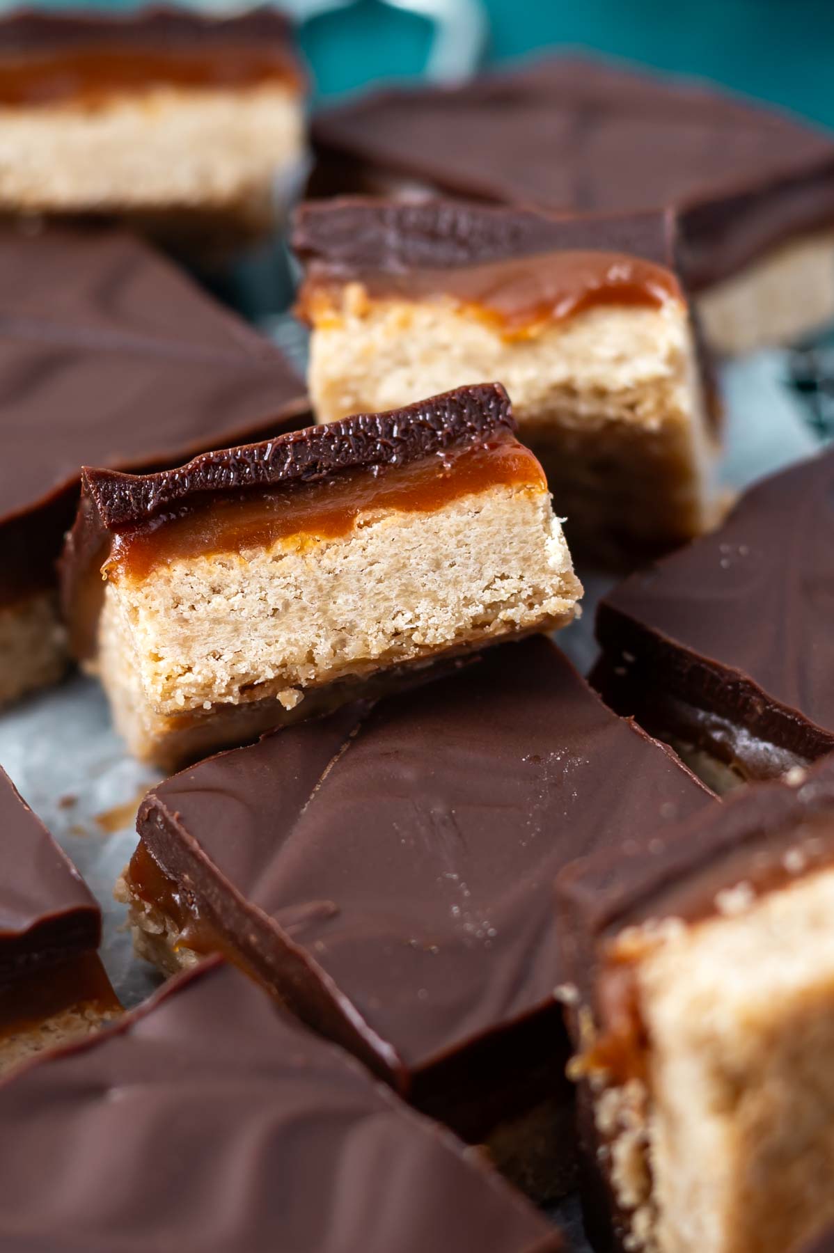 pile of dessert squares with some leaning on top of each other