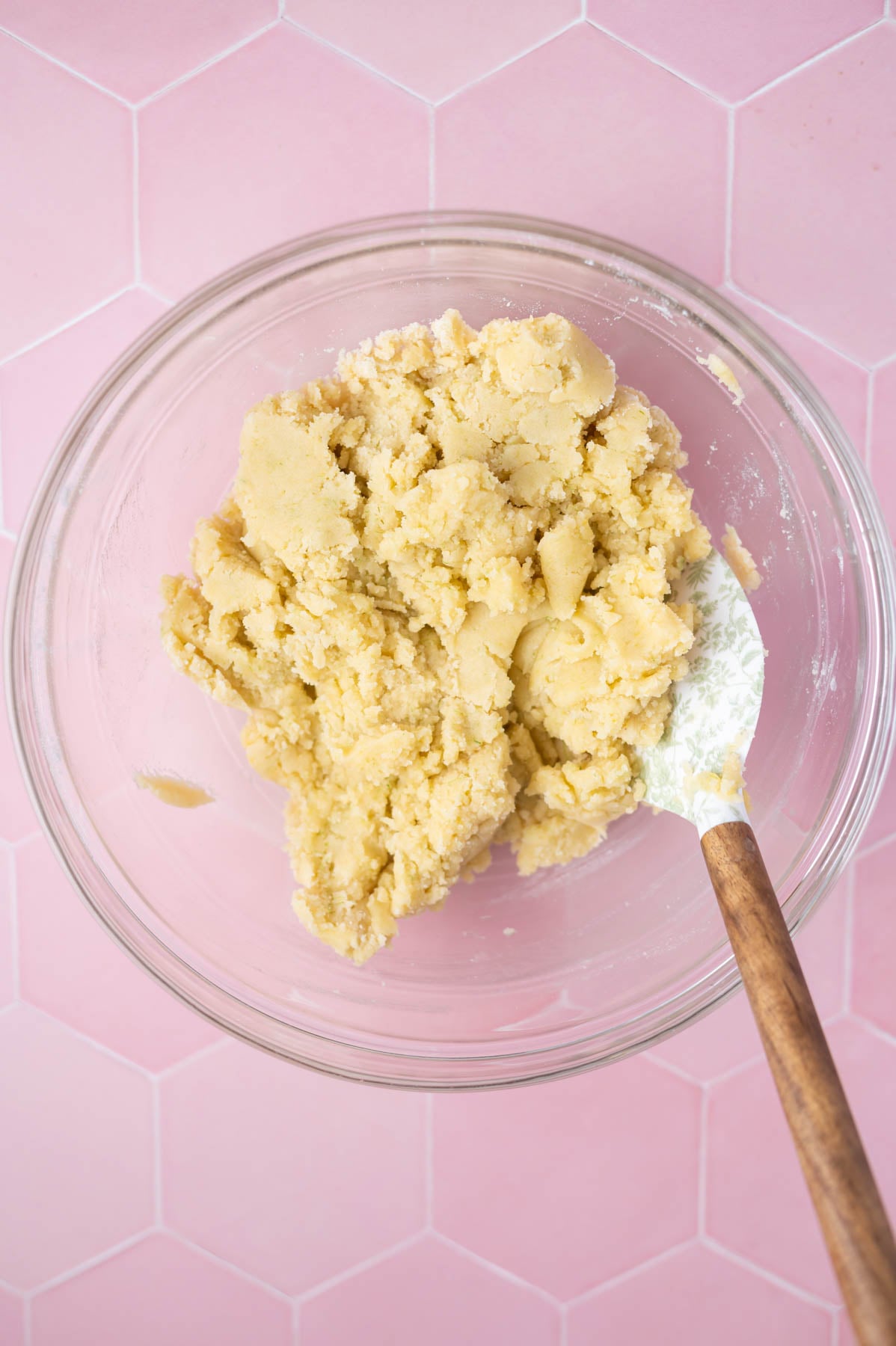 lime sugar cookie dough in a bowl with a spatula