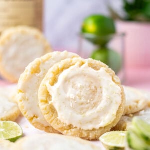 margarita cookies leaning on each other with glaze and sea salt on top