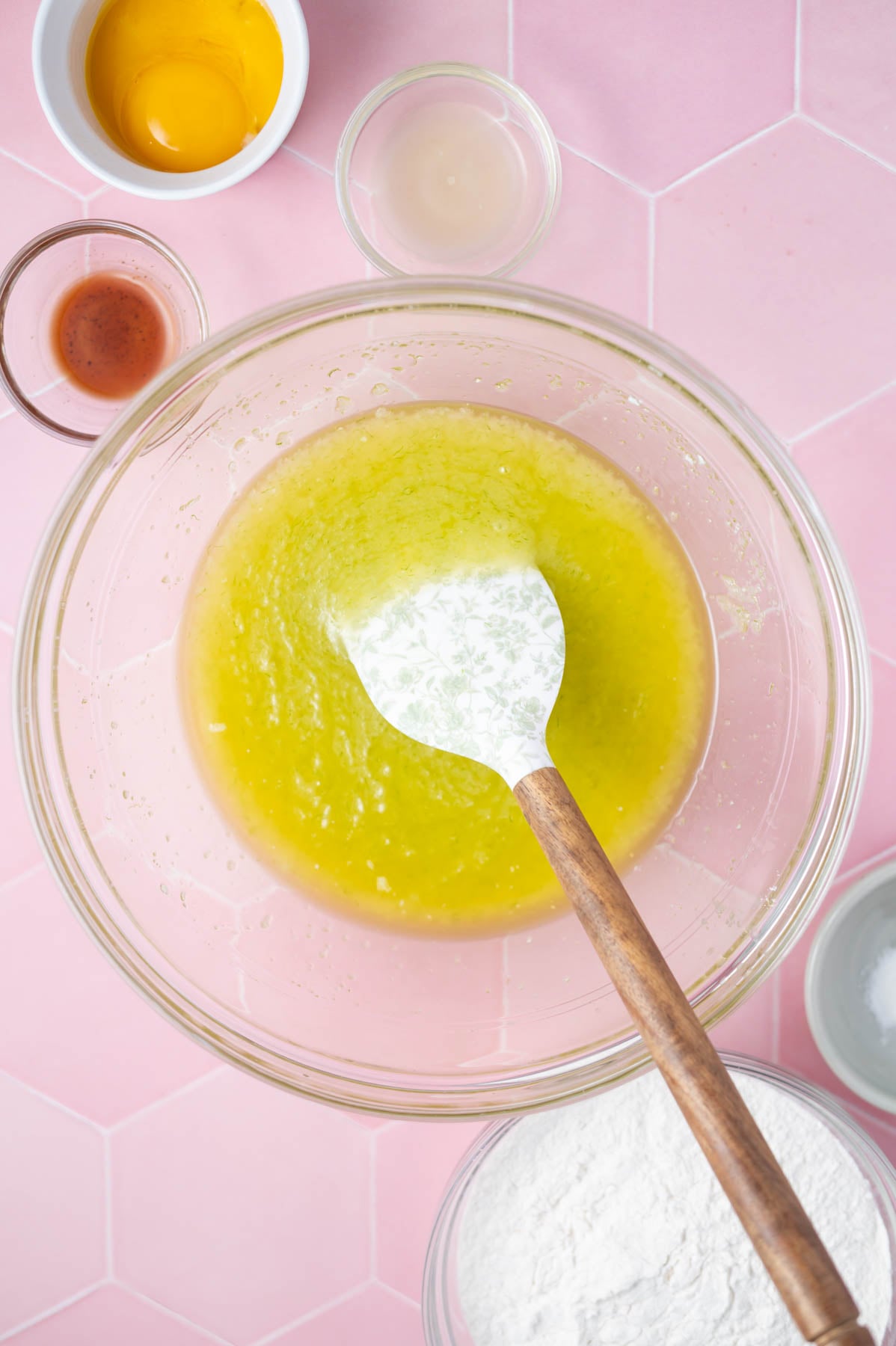 melted butter, lime zest and sugar mixed together in a glass bowl