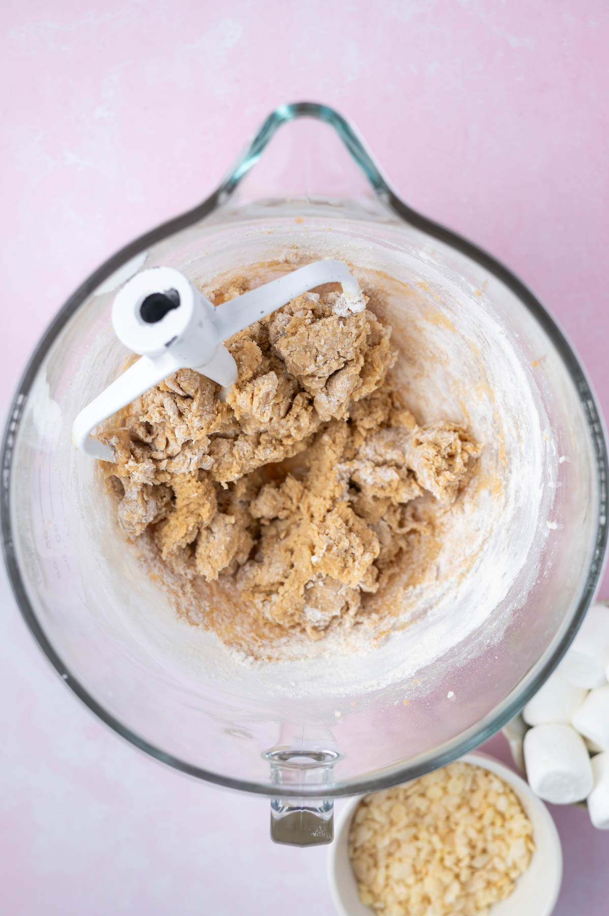 cookie dough in a mixing bowl with just a little flour still showing