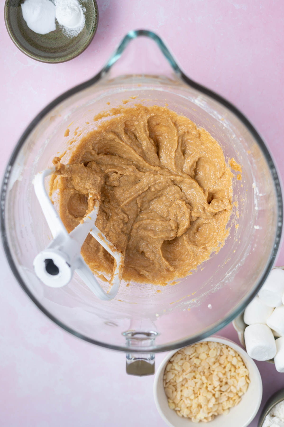 eggs and vanilla beaten into butter and sugars in a mixing bowl