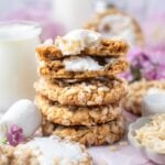 stack of rice crispy cookies with one broken open showing gooey marshmallow middle