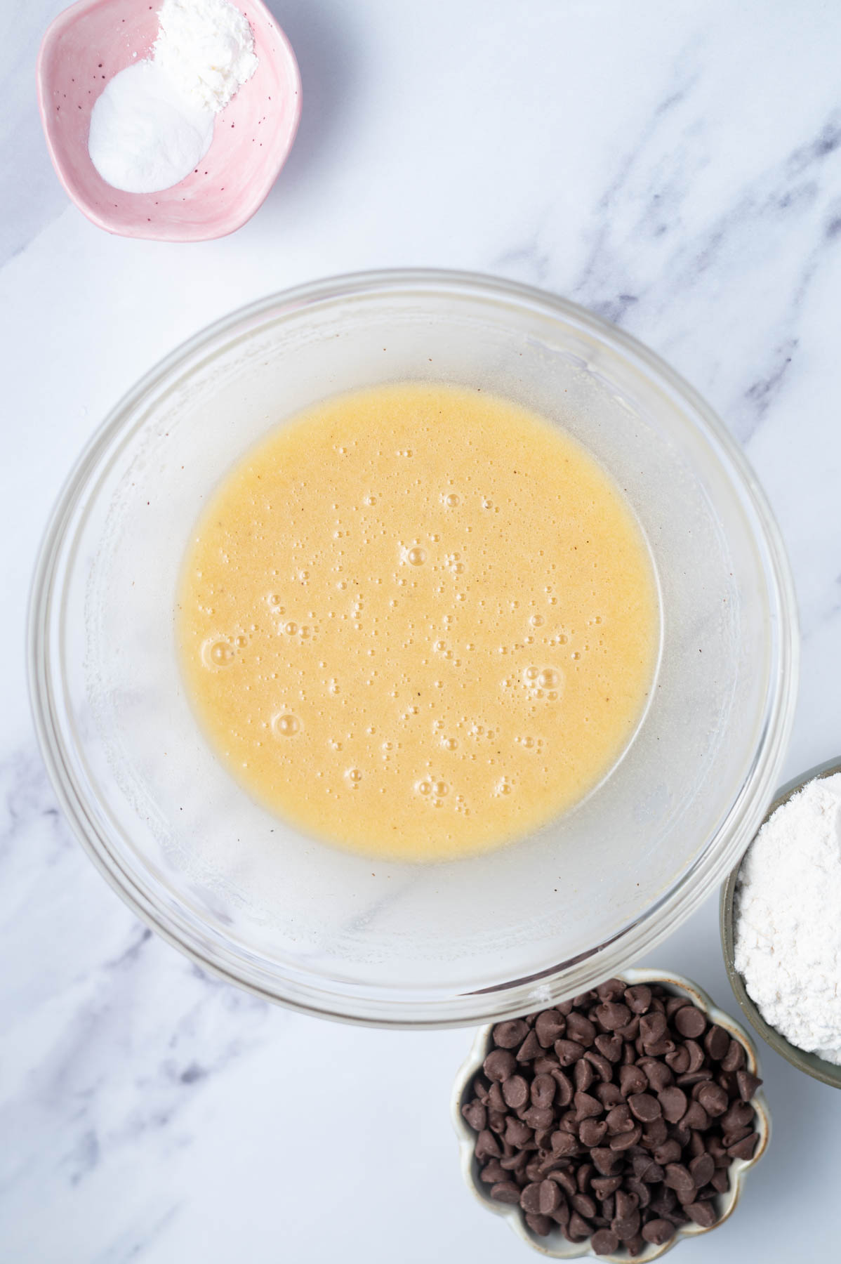 melted butter, white sugar and egg mixed together in a glass bowl