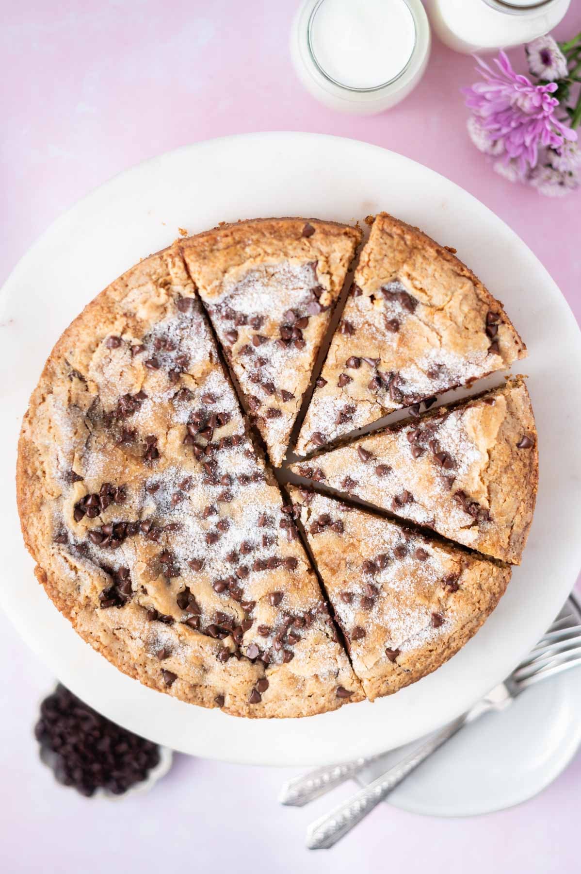 chocolate chip snack cake on a cake stand and cut in slices
