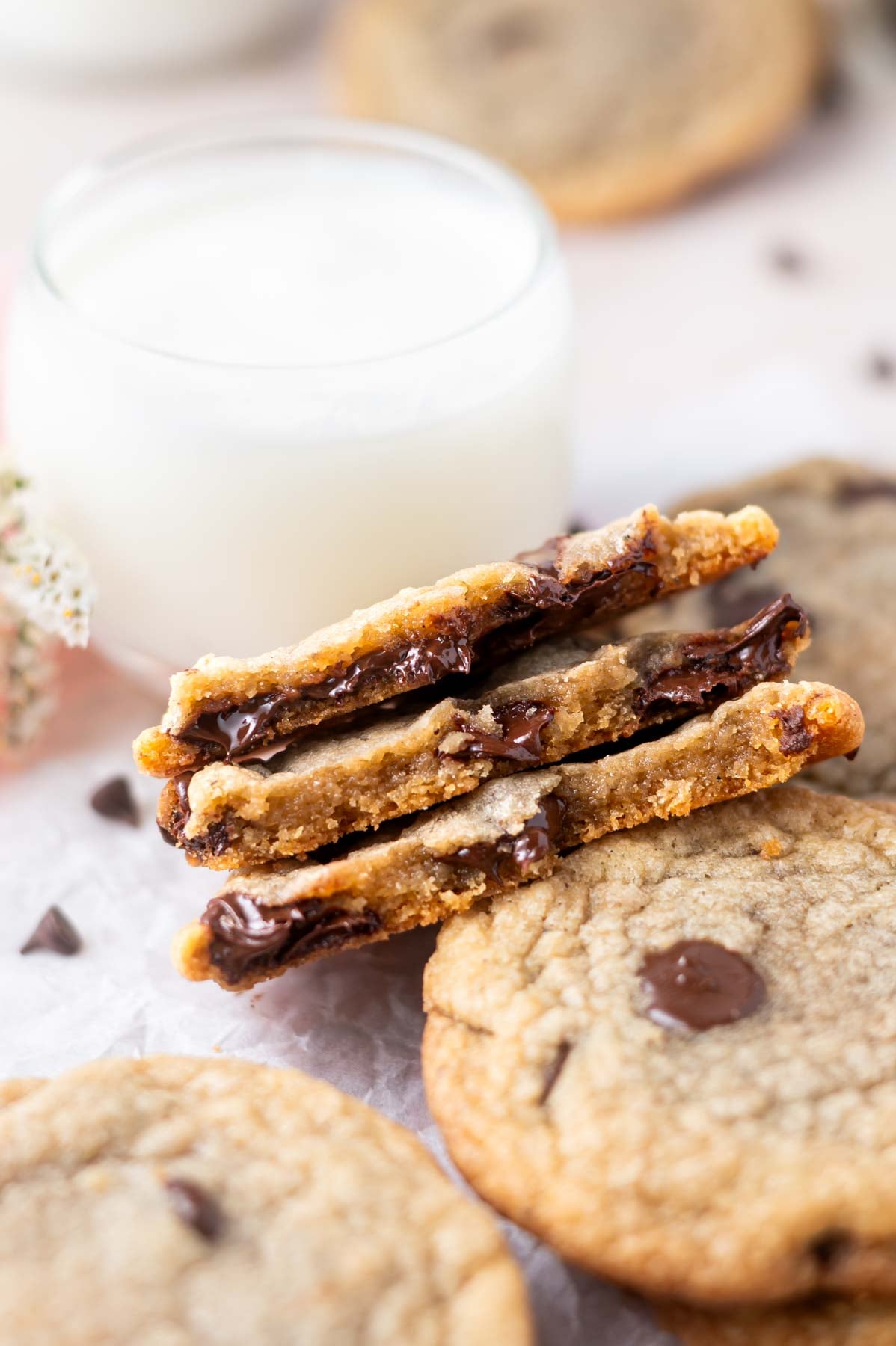 crispy chocolate chip cookies broken in half showing melty chips and chewy inside texture