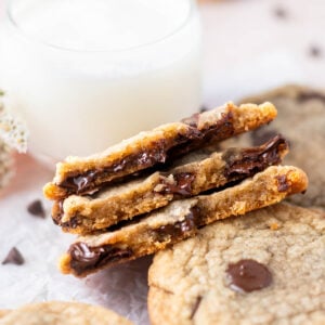 crispy chocolate chip cookies broken in half showing melty chips and chewy inside texture
