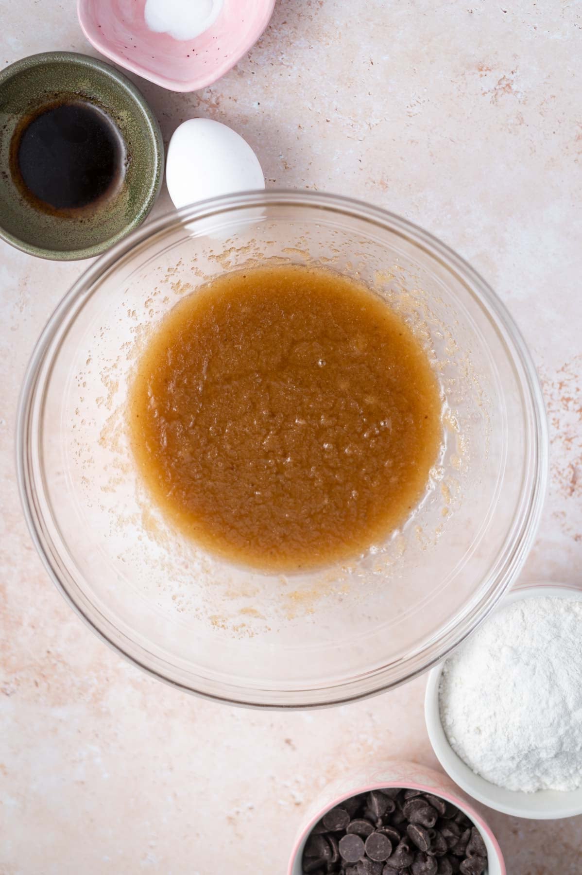 melted butter, sugars and salt mixed together in a glass bowl