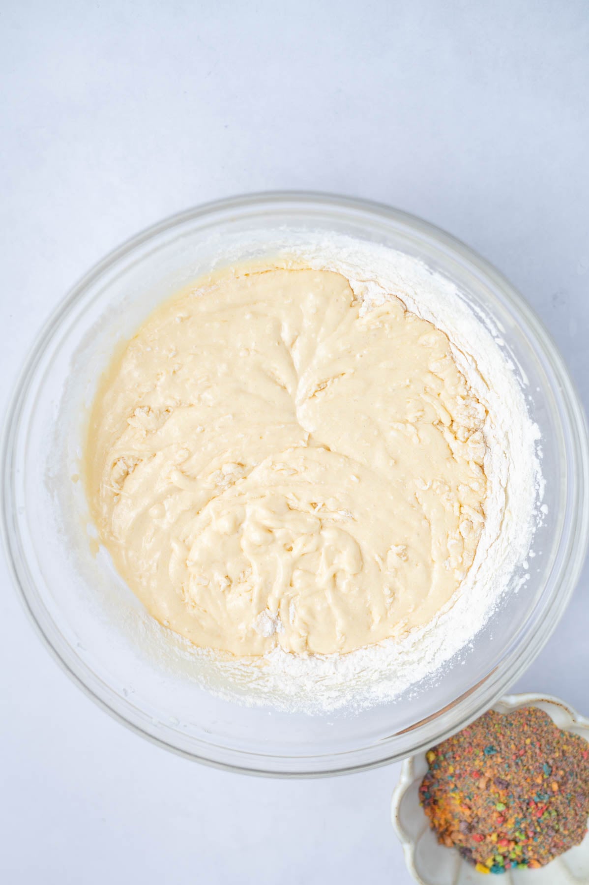 half the flour added to cake batter in a bowl
