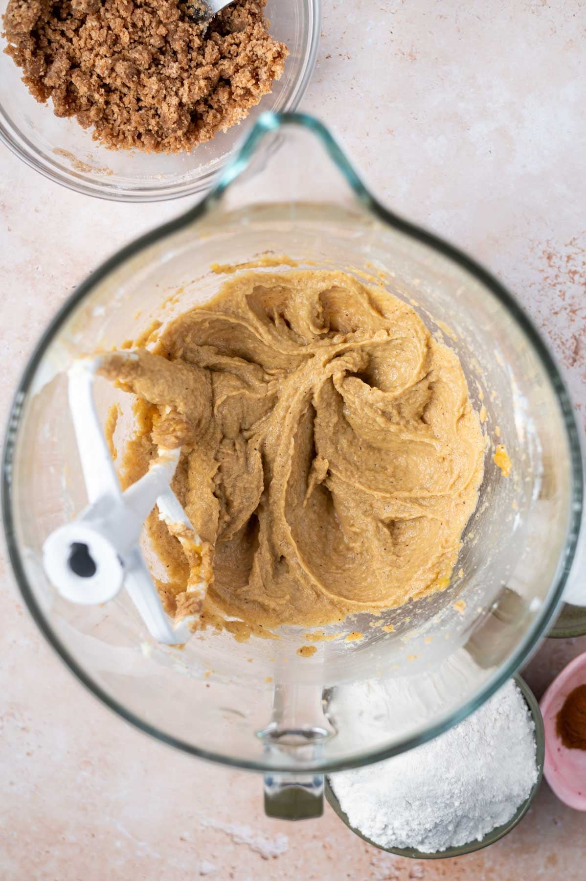 cookie dough after eggs and vanilla are added in a mixing bowl