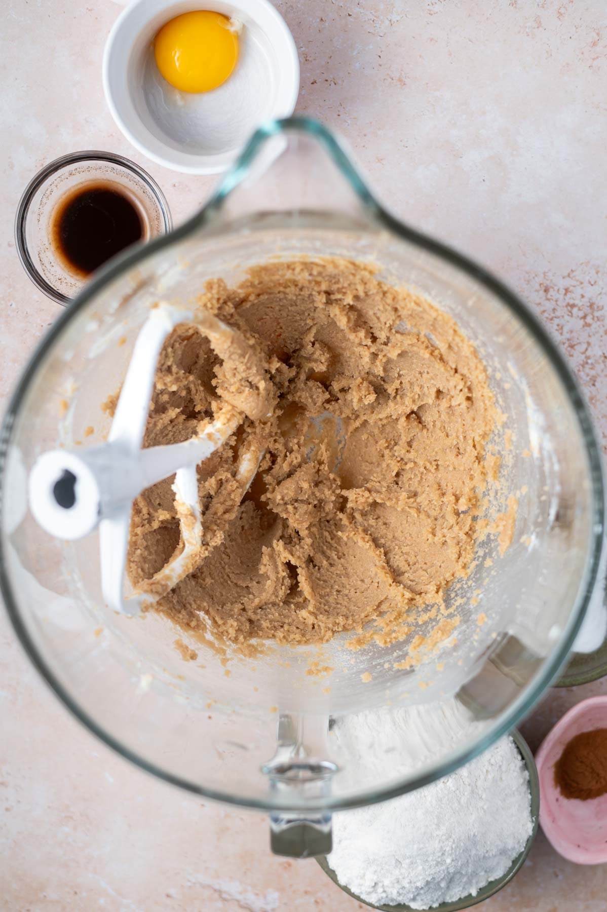 butter, sugars and salt mixed together in a mixing bowl