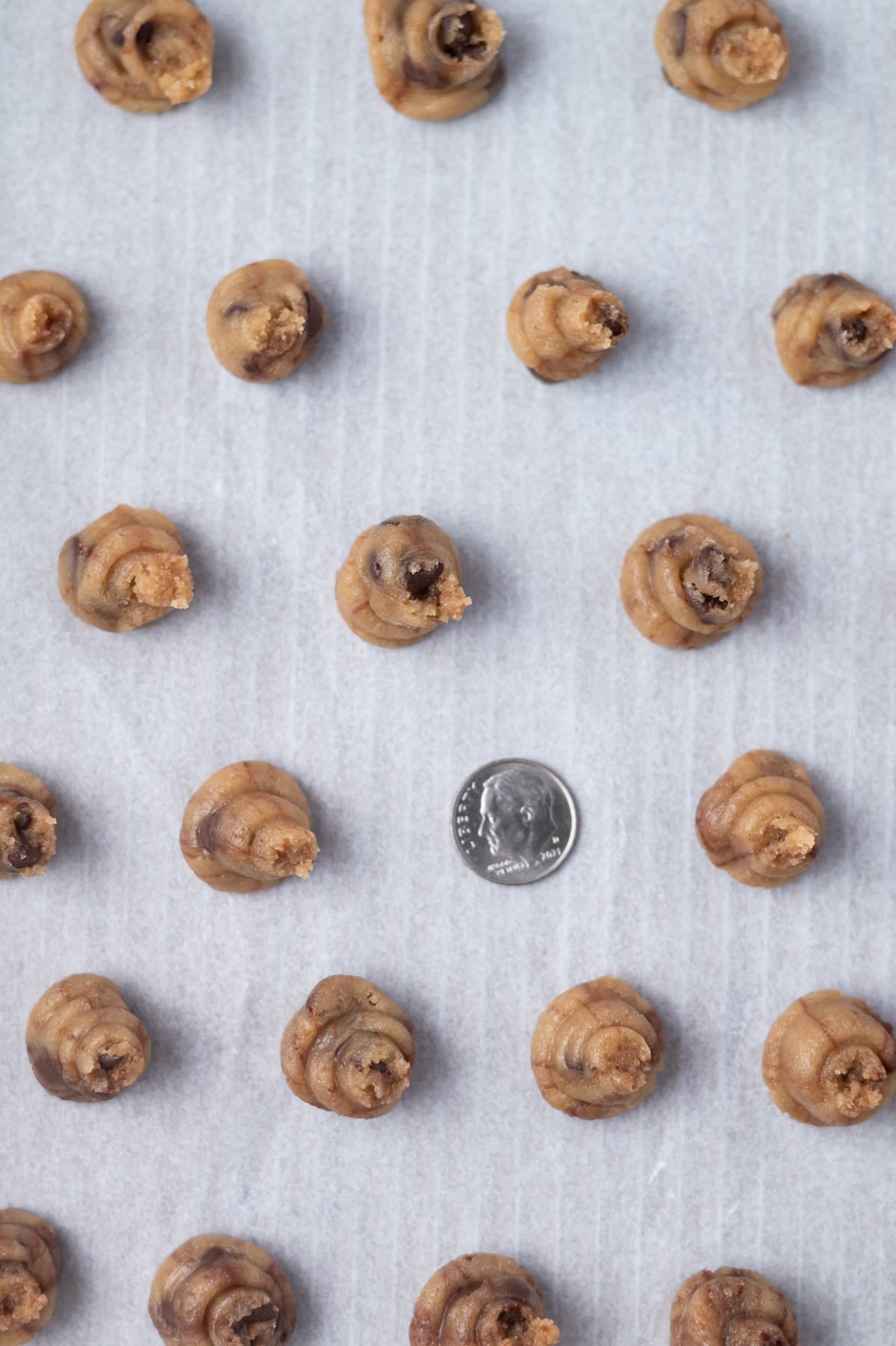 dime size dough on a parchment lined baking pan