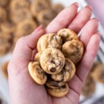 hand holding a pile mini chocolate chip cookies