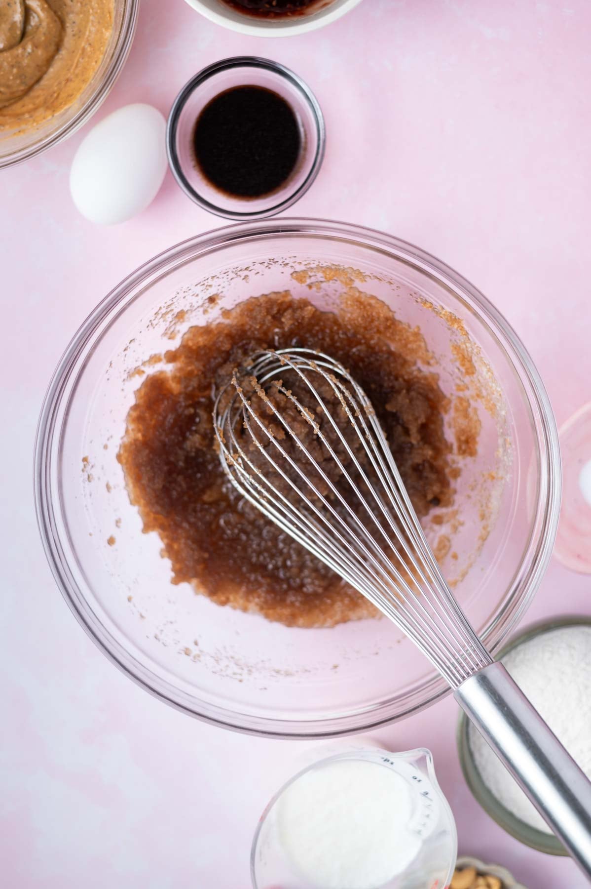 oil, sugars and salt whisked together in a glass bowl
