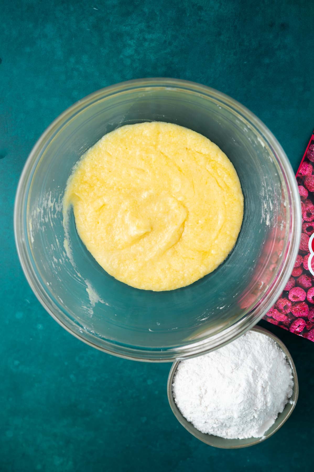 butter and white sugar mixed together in a glass bowl