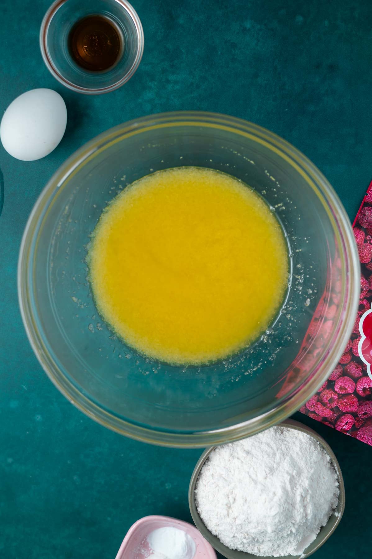 butter and white sugar mixed together in a glass bowl