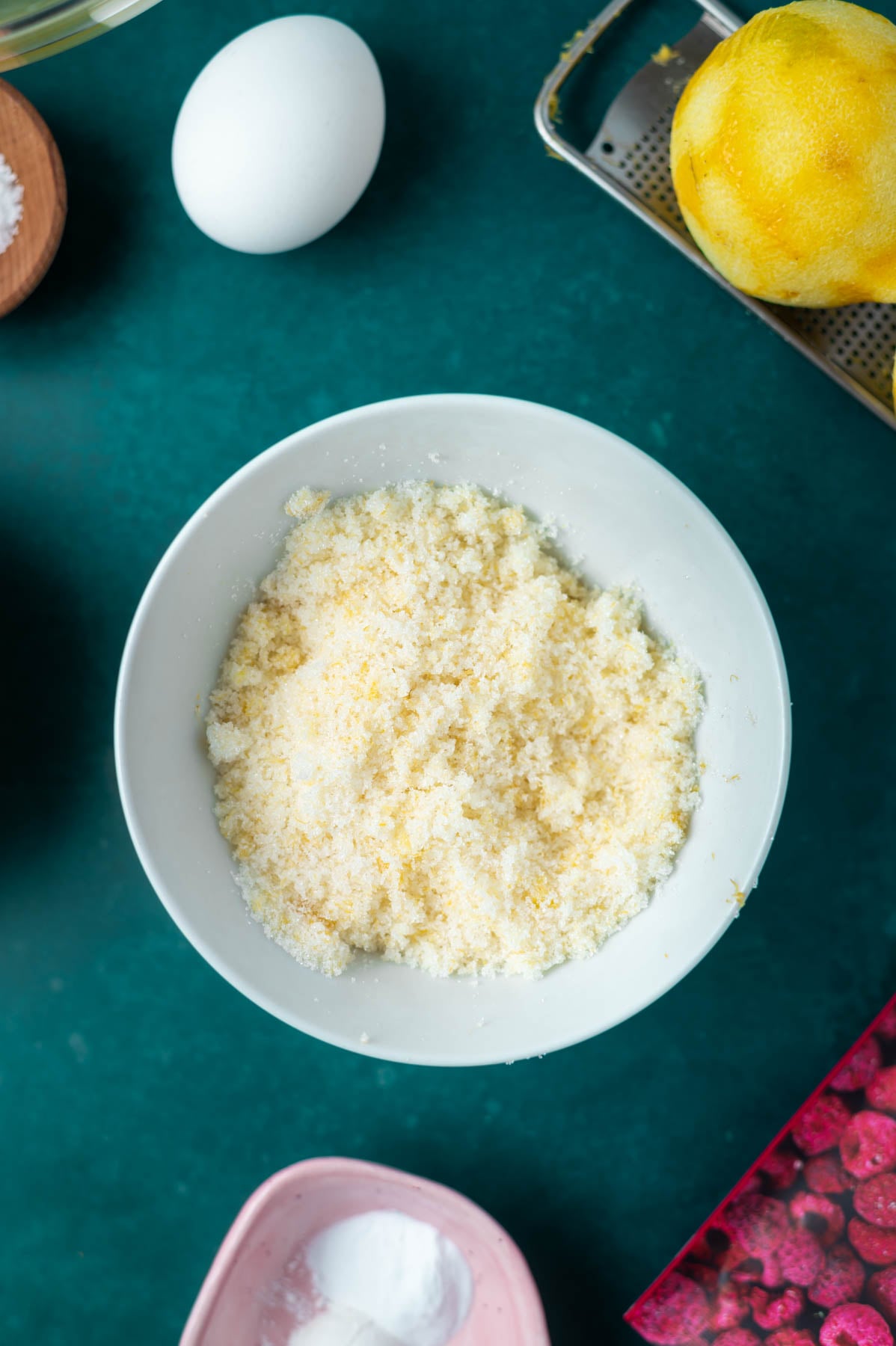 lemon zest worked into sugar in a bowl
