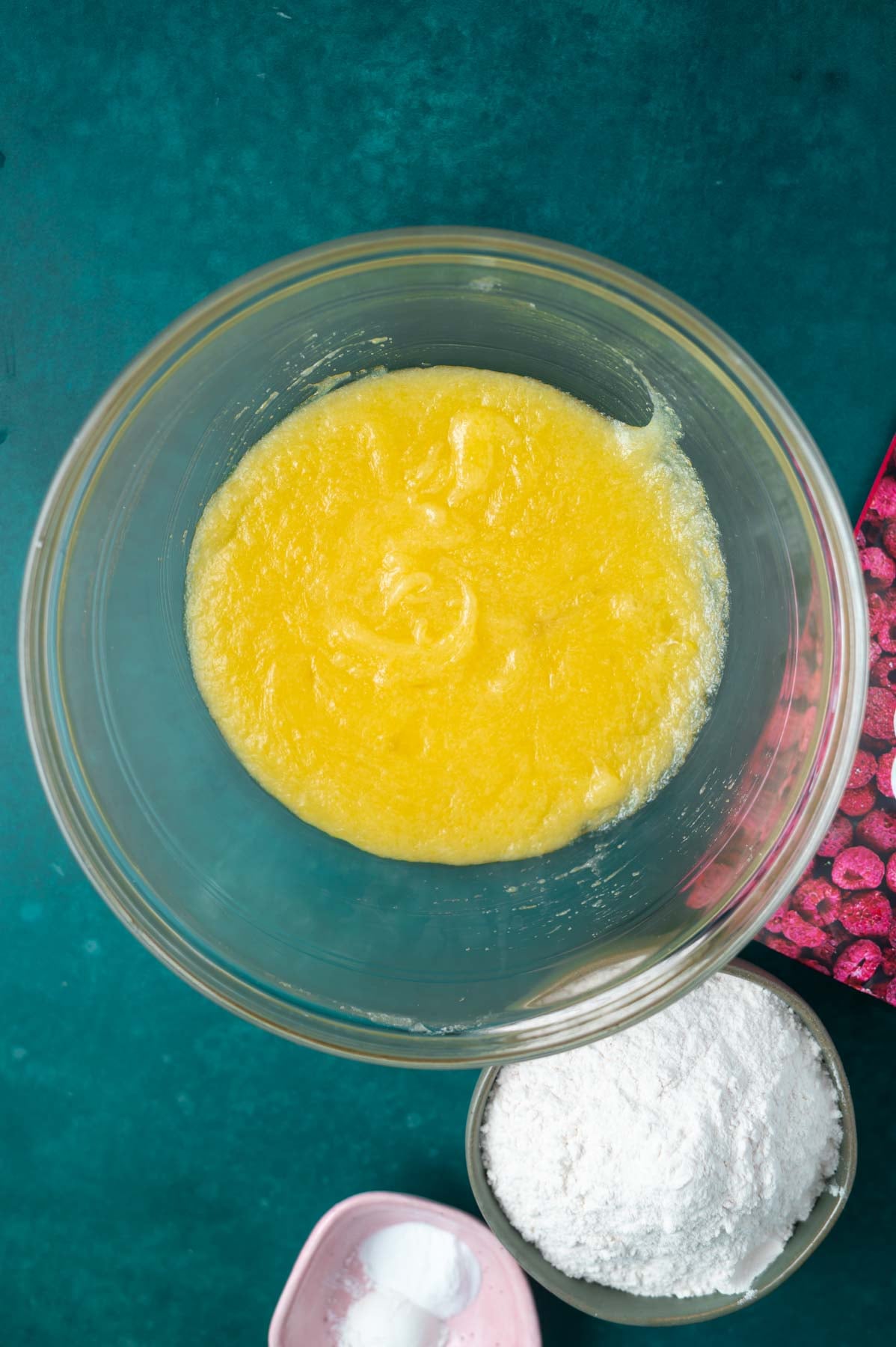 cookie dough in a glass bowl before baking soda and flour added