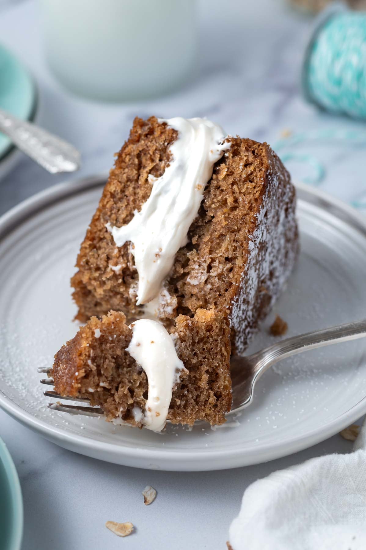 slice of oatmeal cream pie cake on a plate with a bite on a fork