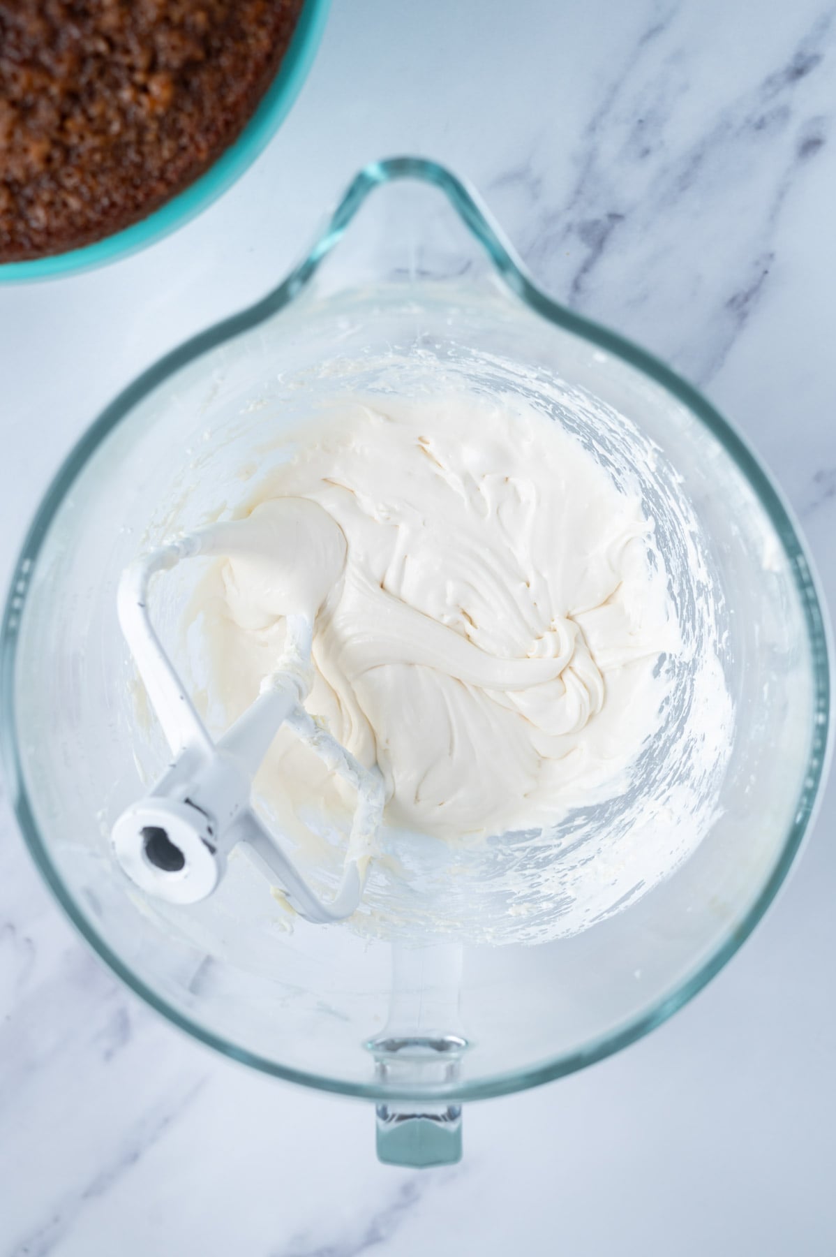 marshmallow fluff added to butter and confectioners' sugar in a mixing bowl
