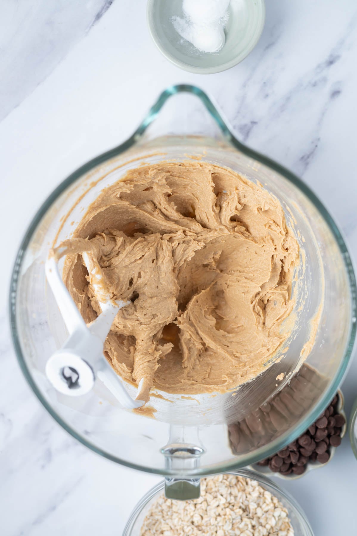 cookie dough in a mixing bowl after the egg and vanilla have been added