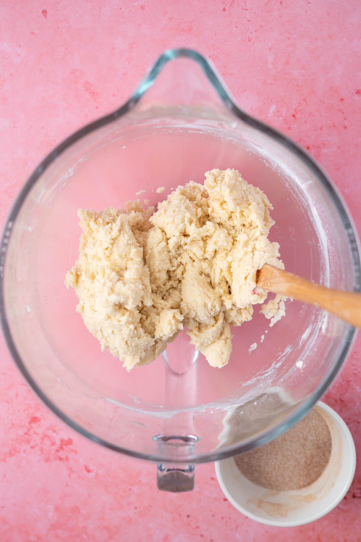 cookie dough in a mixing bowl with a spatula
