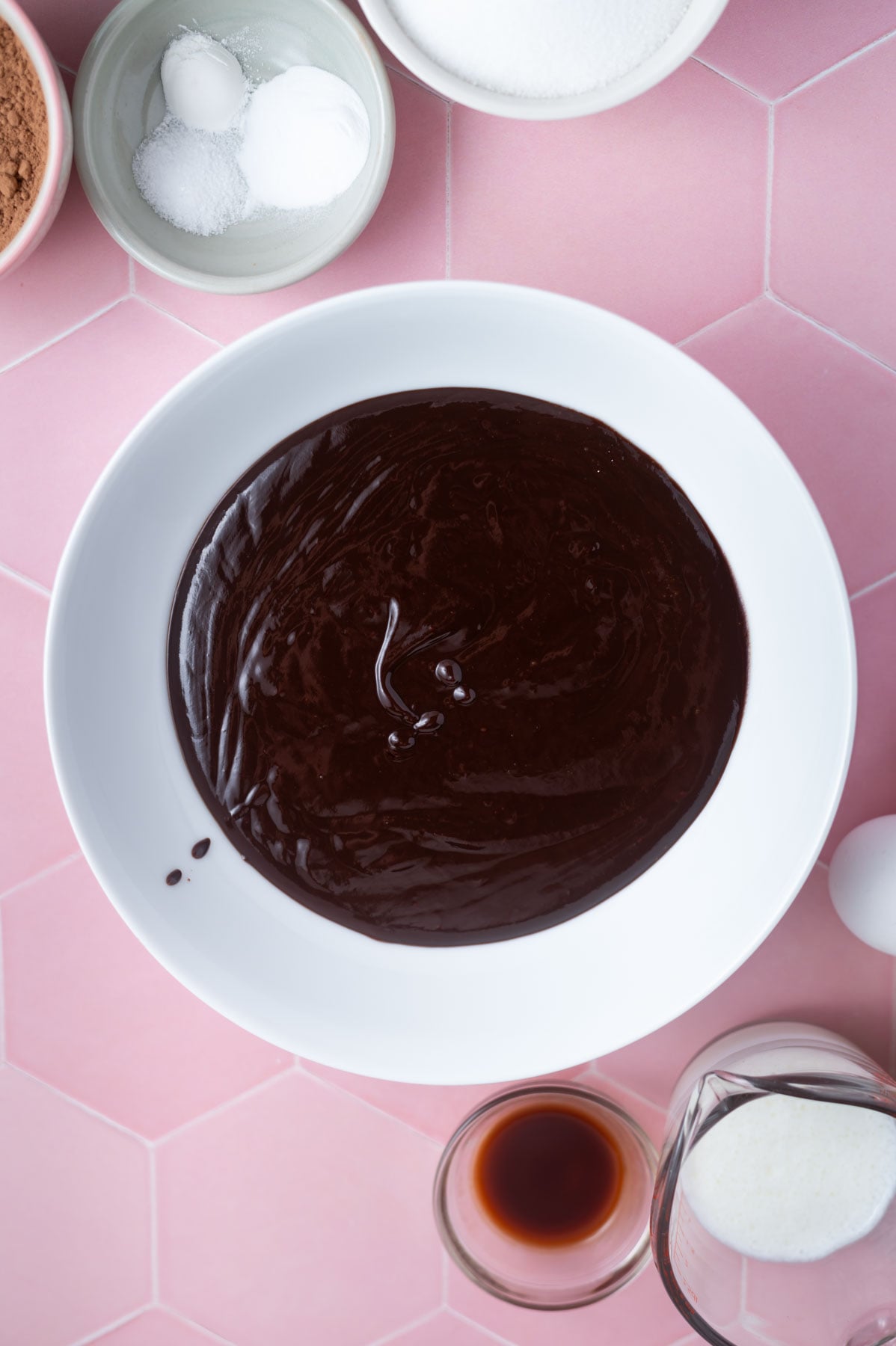 soft chocolate ganache frosting cooling in a bowl