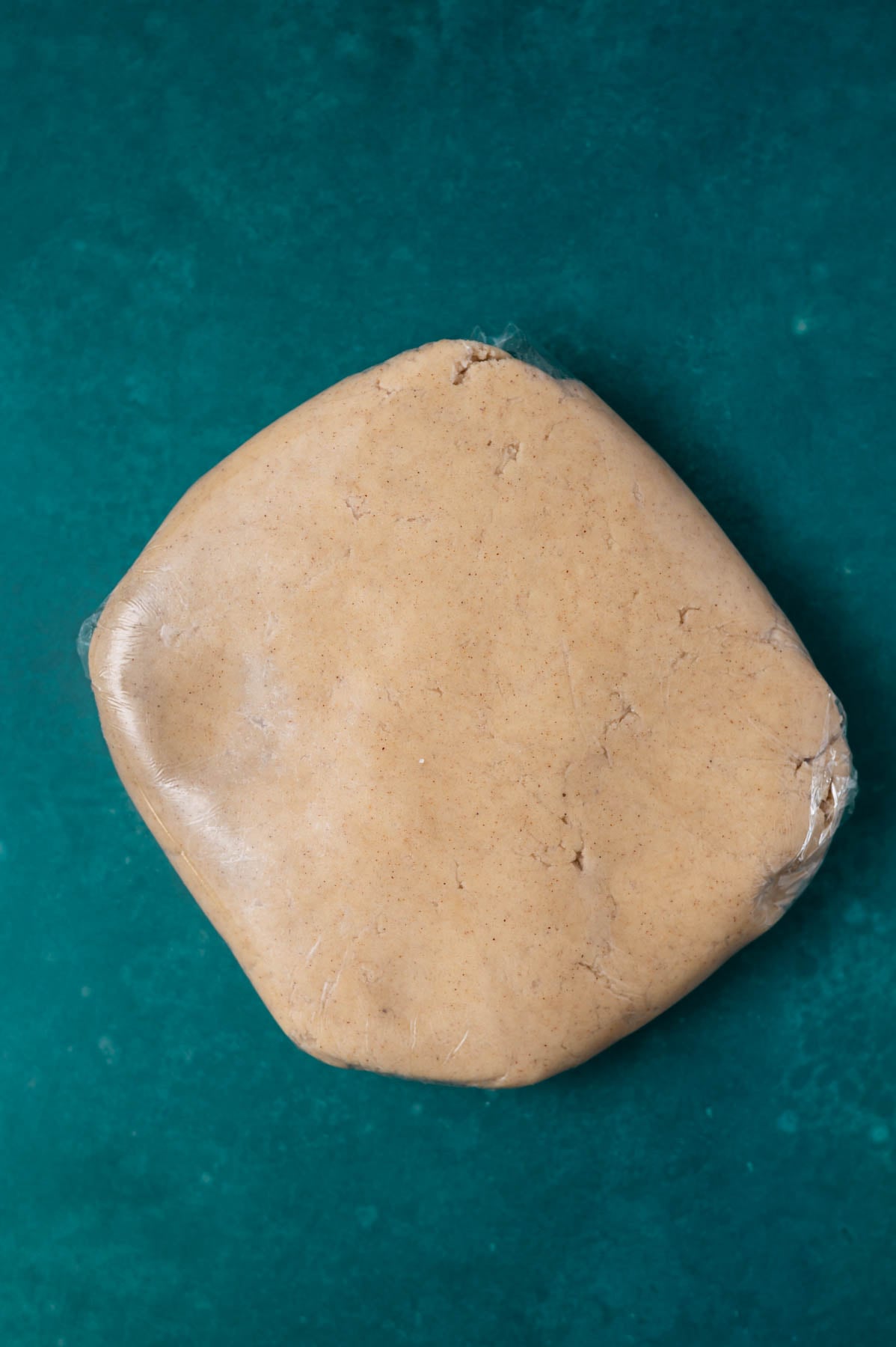 cinnamon sugar cookie dough wrapped in plastic wrap
