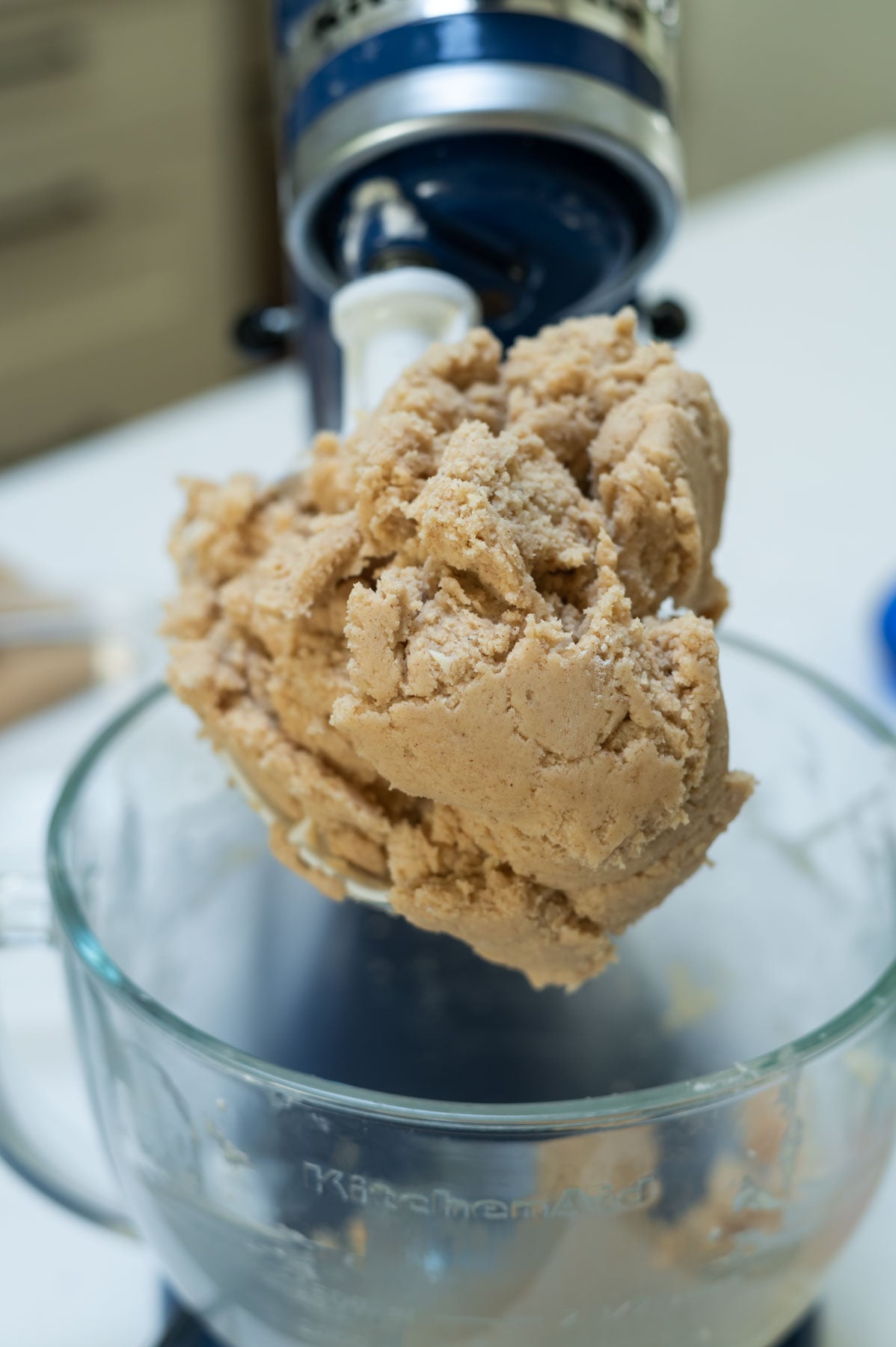 cookie dough balled up on mixer paddle