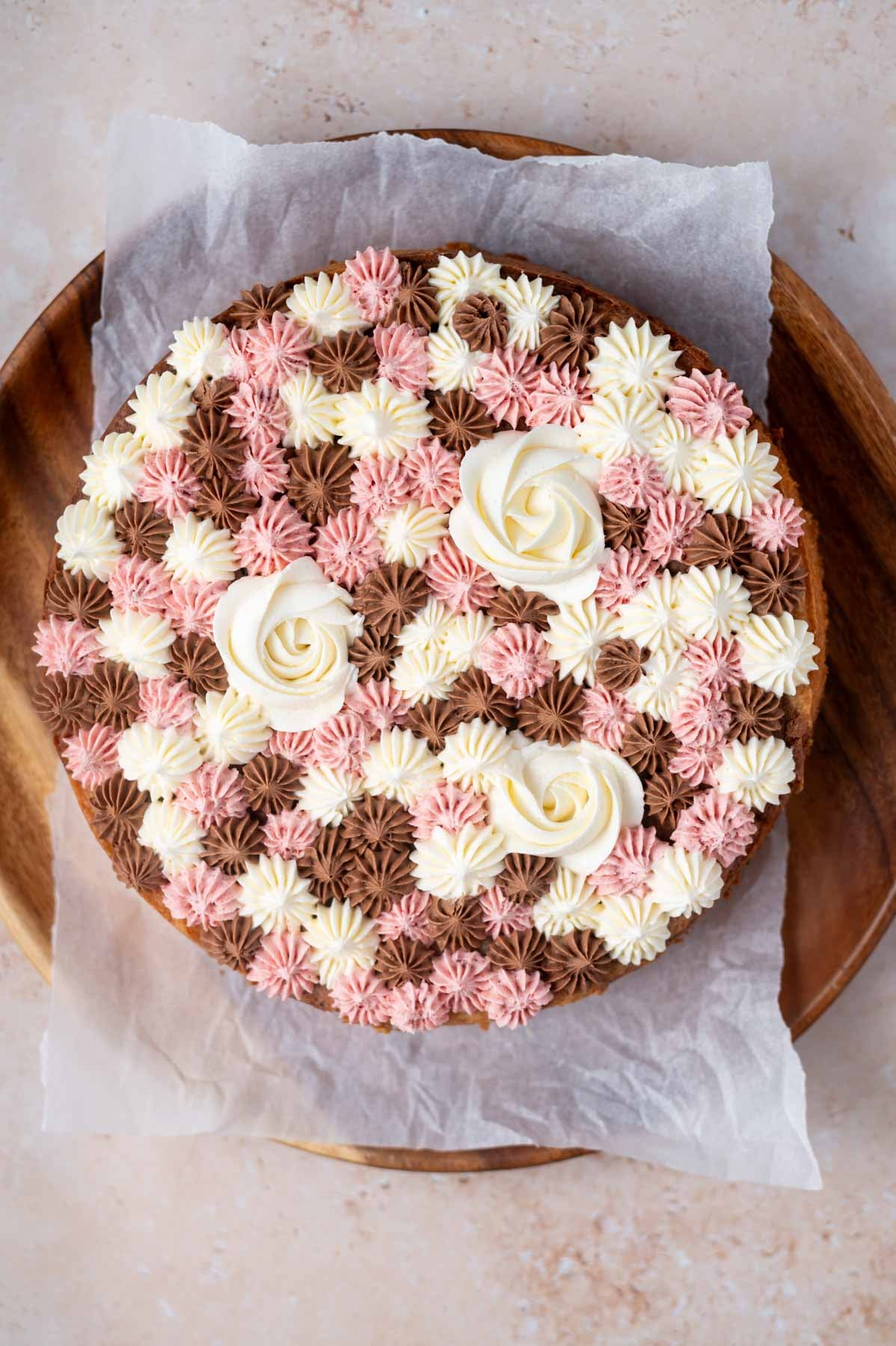 piped cake top with neapolitan flavored frosting
