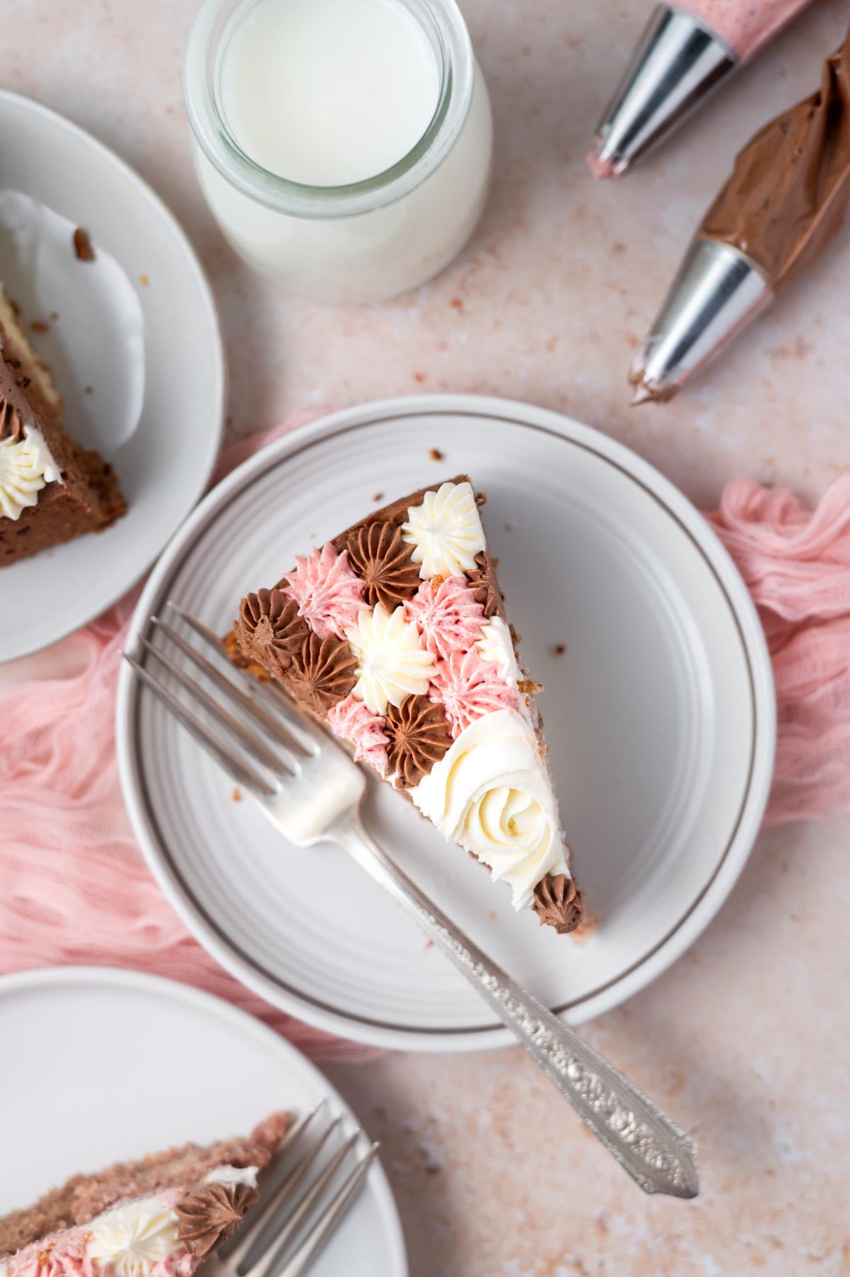 overhead look at a slice of cake on a plate with a fork