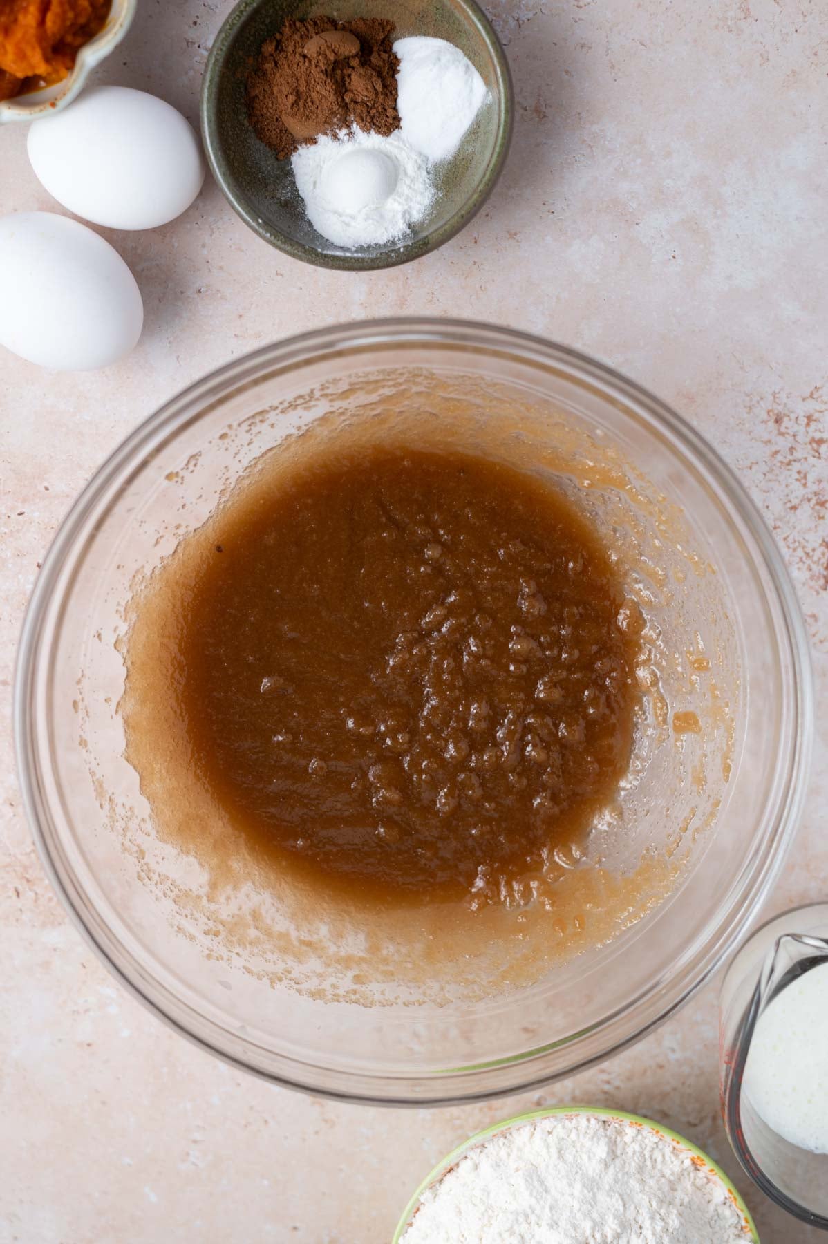 butter and sugars whisked together in a mixing bowl
