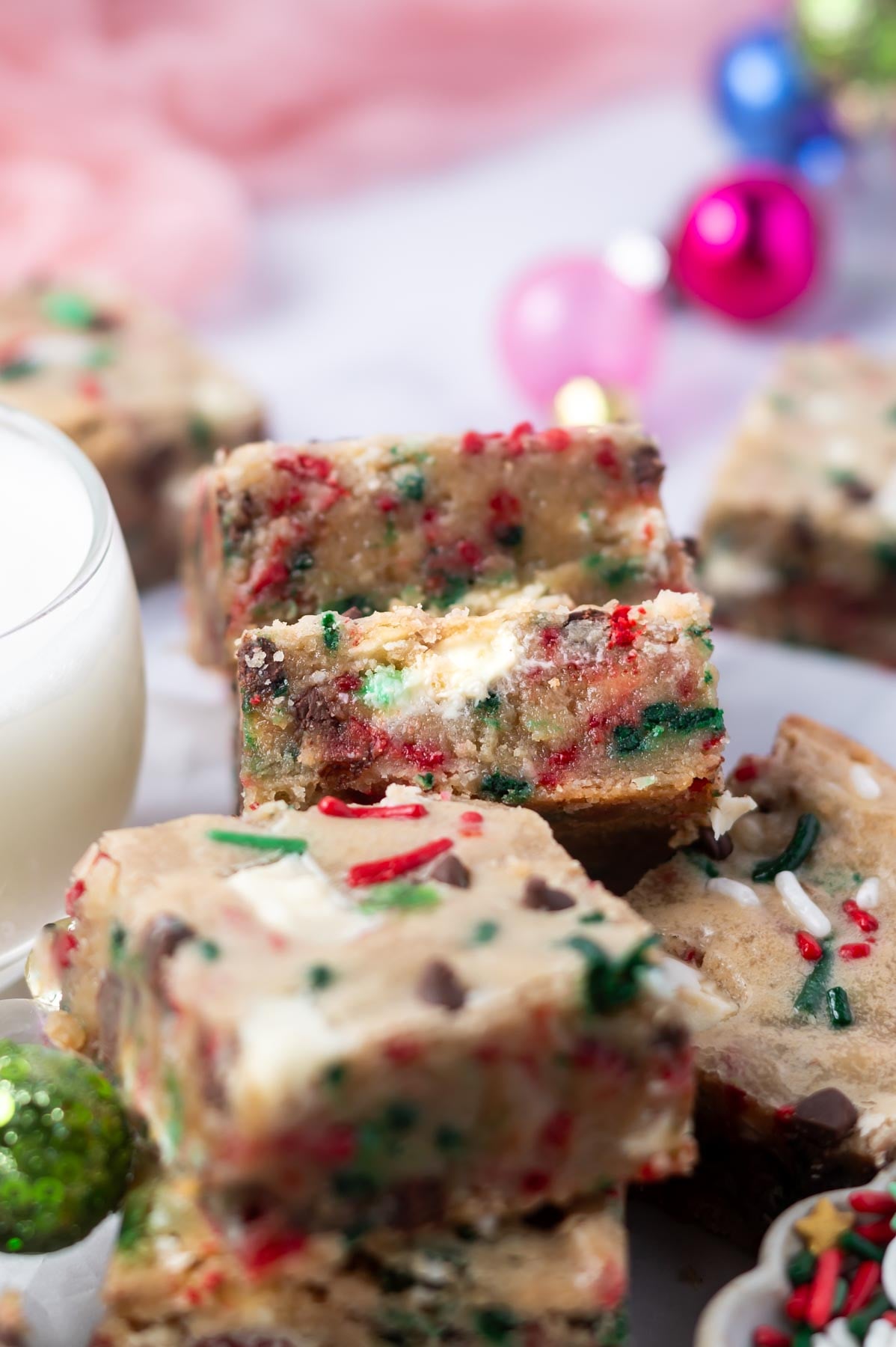 blondies leaning against one another showing sprinkles and white chocolate middle