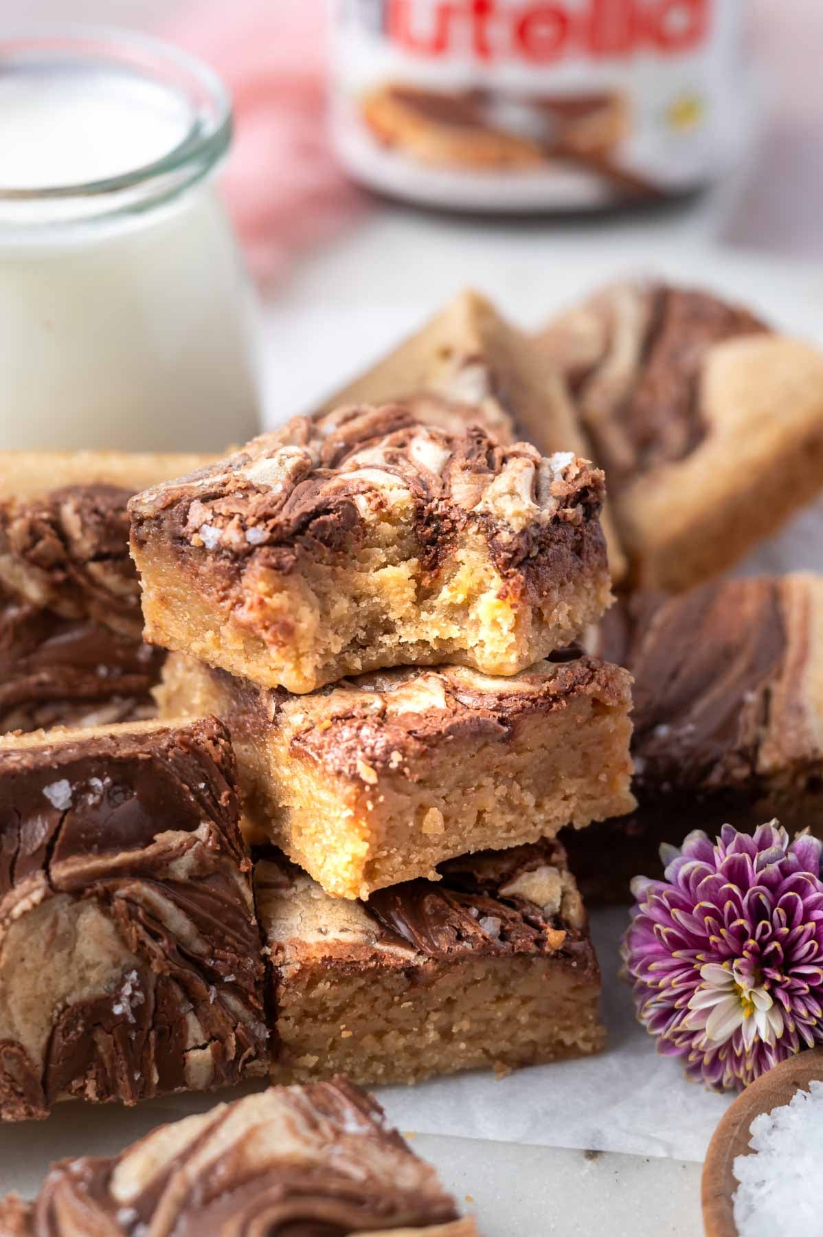 stack of blondies with the top one missing a bite